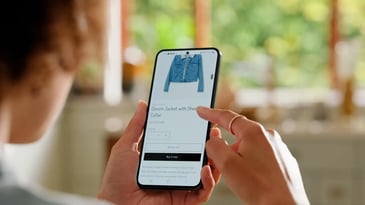 A person using AI to search and shop for a denim jacket.