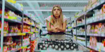 Confused Shopper Thinking What to Buy in a Supermarket