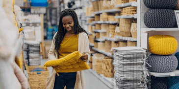 A woman shopping for home decor in a store