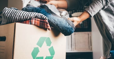 Recycled clothing in box - Sustainability