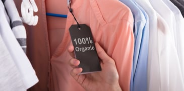 Organic clothing tag on shirt at a retail store